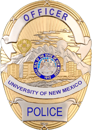 UNM PD Badge reads Officer, University of New Mexico, Police with NM State Seal
